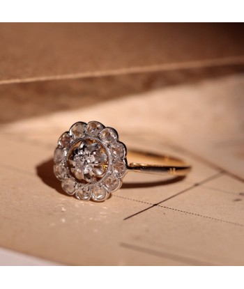 Bague marguerite ancienne deux ors et diamants Pour